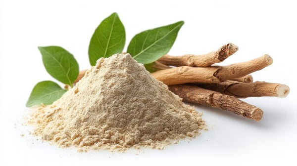 Ashwagandha root powder with whole Withania somnifera roots and green leaves on a white background.