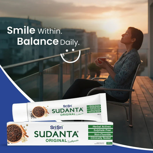 Sudanta Original toothpaste tube and box with woman relaxing on balcony at sunset