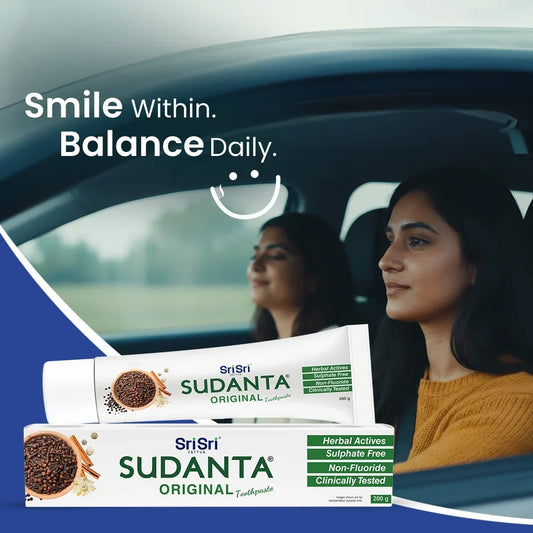 Sudanta Original herbal toothpaste tube and box with two women smiling in a car