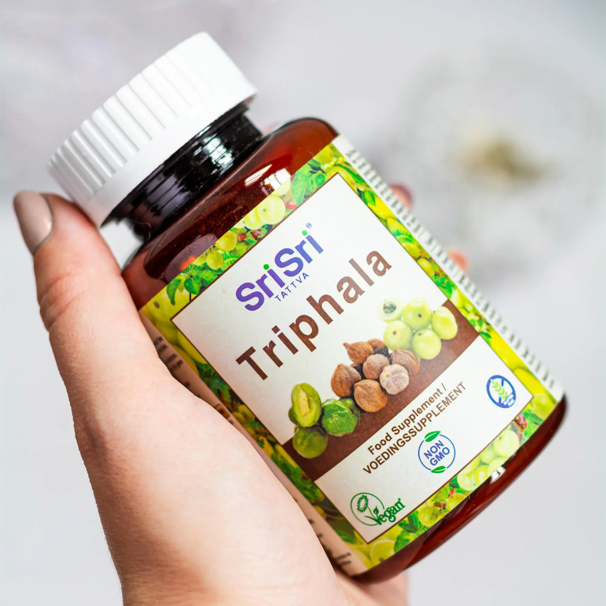 Sri Sri Tattva Triphala herbal supplement, Ayurvedic blend of amla, haritaki, and bibhitaki for digestion, gut health, and natural detox support.&nbsp;
