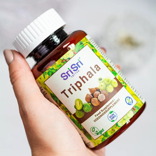 Sri Sri Tattva Triphala herbal supplement, Ayurvedic blend of amla, haritaki, and bibhitaki for digestion, gut health, and natural detox support.&nbsp;